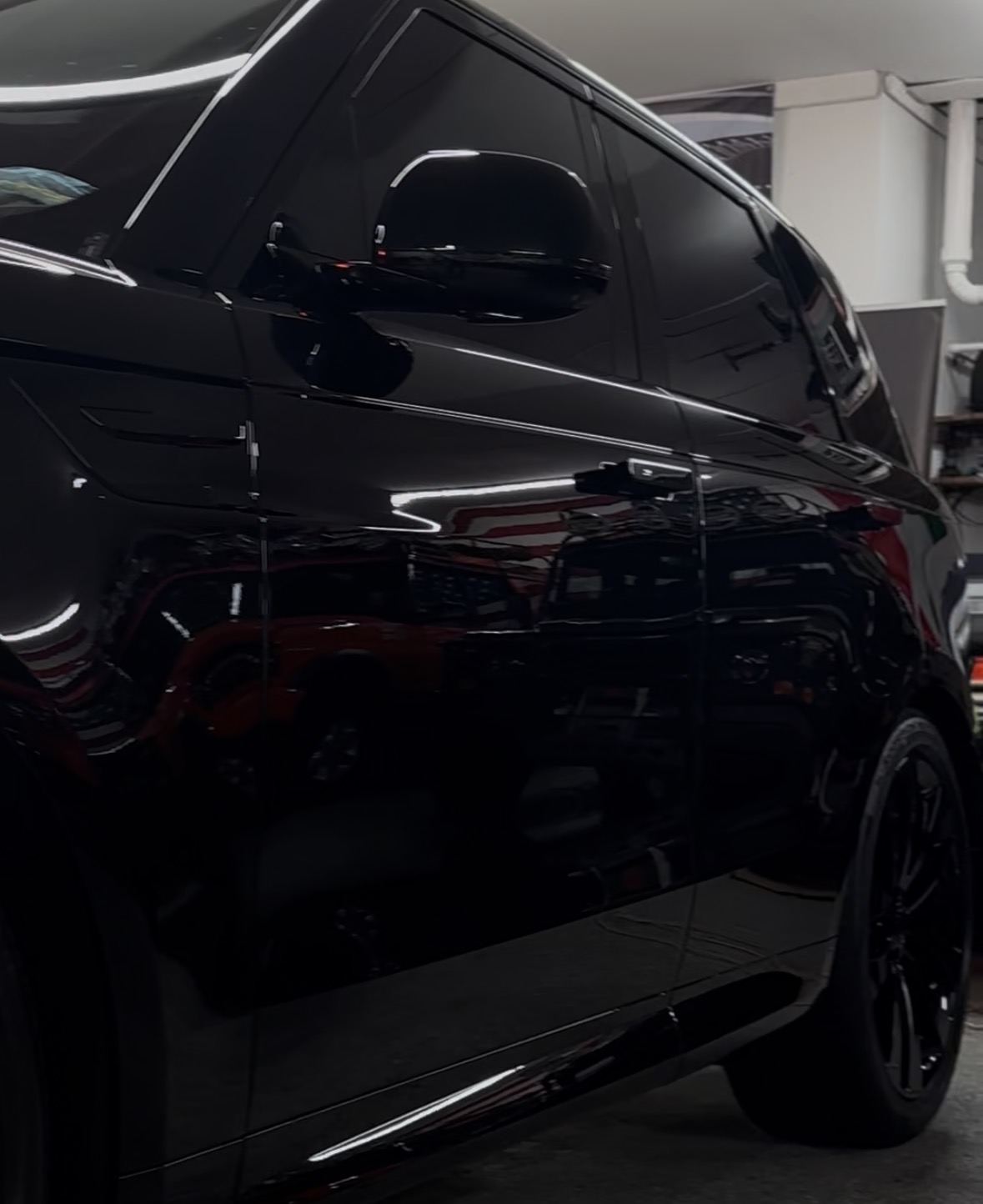 Ceramic coated black SUV showing deep gloss finish — JC Details LLC